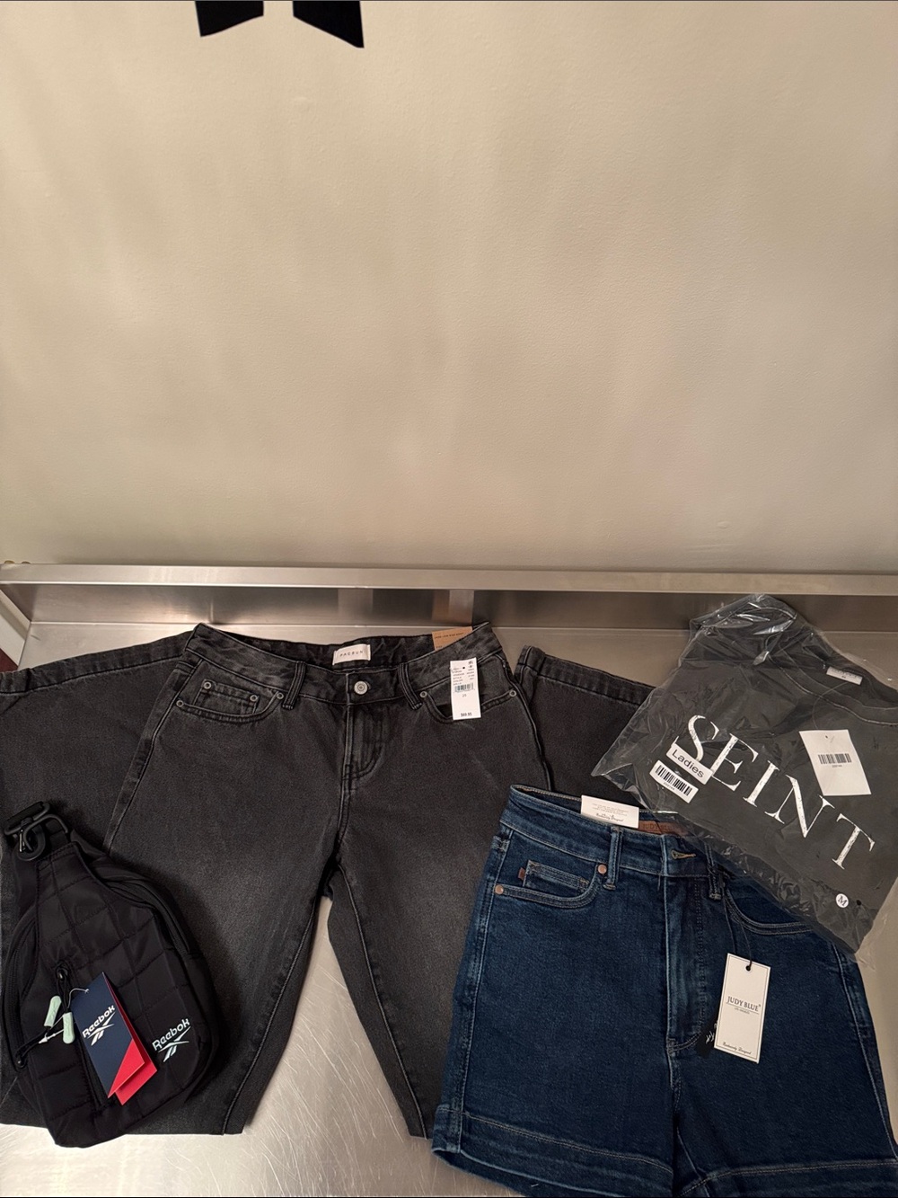 Judy Blue shorts, Seint top, Reebok crossbody bag,& Pacsun jeans
